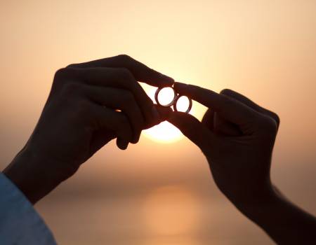 wedding rings and Costa Rica beach sunset