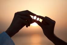 wedding rings and Costa Rica beach sunset